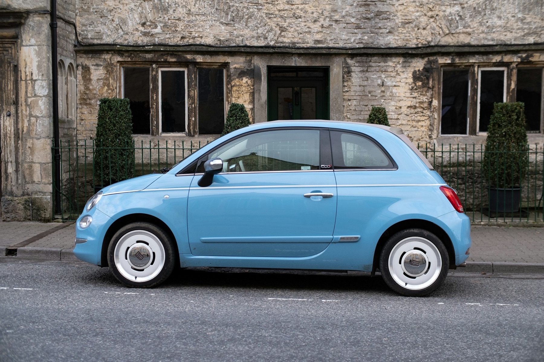 Modern Fiat 500 on a stone-built Irish street — the passenger cars Geraghty covers on local call-out
